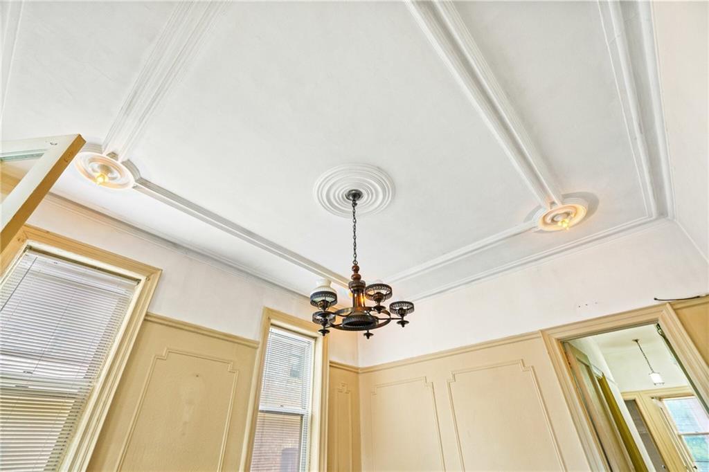 282 Buffalo Avenue Brooklyn, NY 11213 - Photo 9 of 22 a view of a hallway with a chandelier