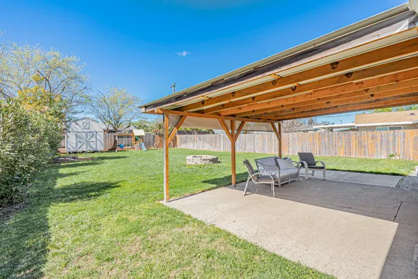 a patio with table and chairs