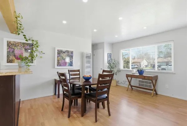 a view of a dining room with furniture window and outside view