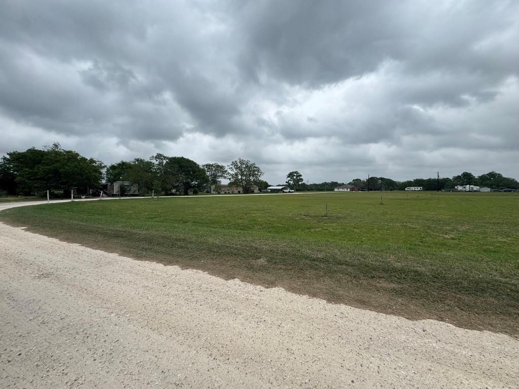1 Riverside Drive Palacios, TX 77465 - Photo 8 of 29 a view of a golf course with a lake