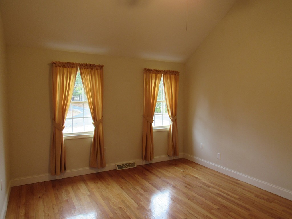 63 Valley Road Southampton, MA 01073 - Photo 12 of 18 an empty room with wooden floor and windows