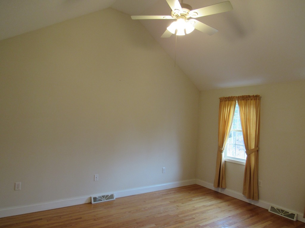 63 Valley Road Southampton, MA 01073 - Photo 13 of 18 a view of empty room with wooden floor and fan
