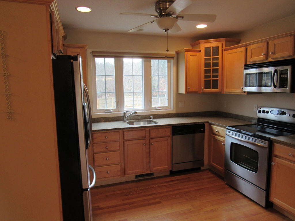 63 Valley Road Southampton, MA 01073 - Photo 7 of 18 a kitchen with stainless steel appliances granite countertop a stove a sink and a refrigerator