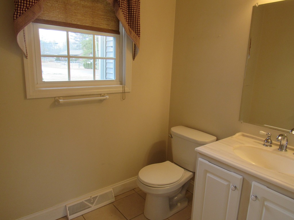 63 Valley Road Southampton, MA 01073 - Photo 10 of 18 a white toilet sitting next to a bathroom sink