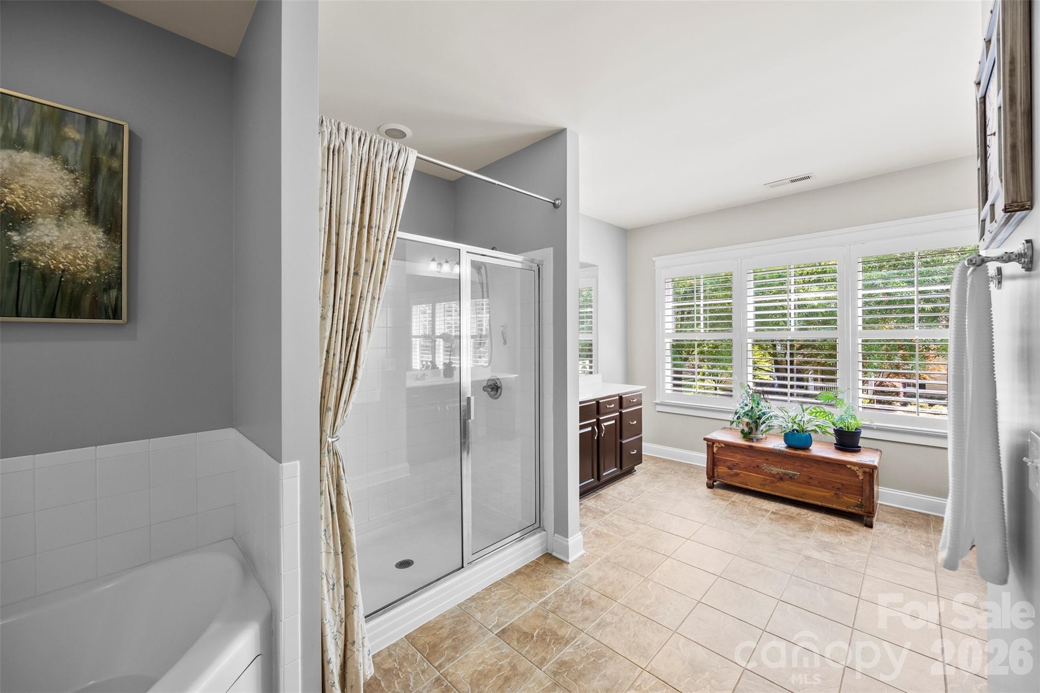 606 Andover Lane Tega Cay, SC 29708 - Photo 23 of 48 a spacious bedroom with a bed and glass door
