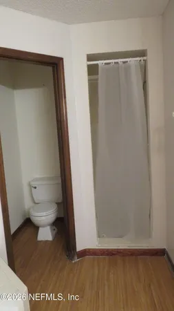 a view of empty room with a fireplace