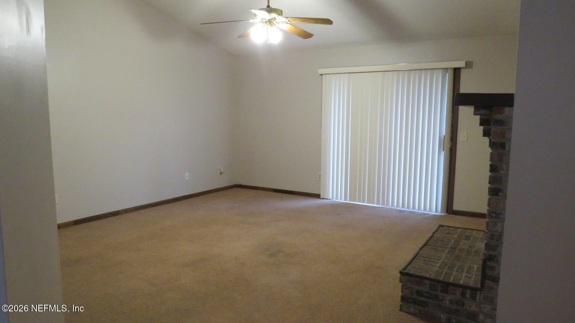 1878 Shadow Ridge Trail Jacksonville, FL 32225 - Photo 18 of 29 a view of a room with a ceiling fan and a window