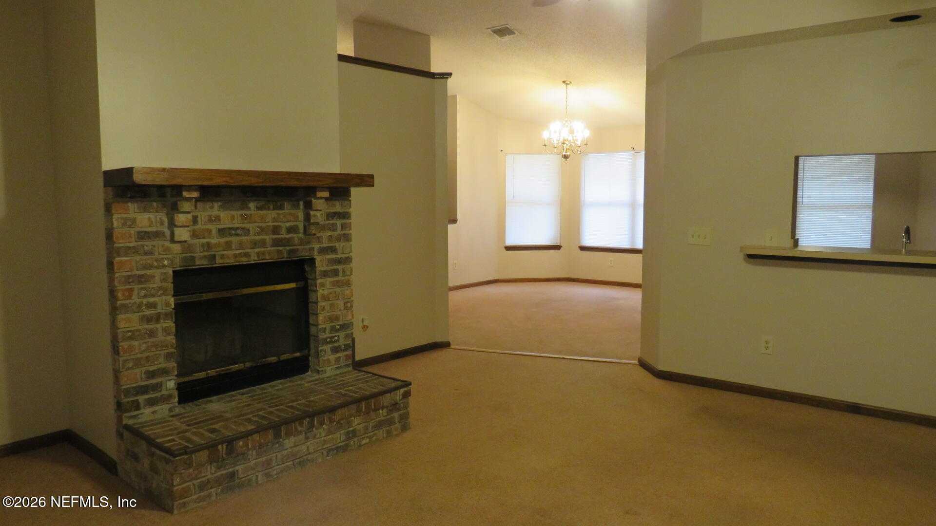 1878 Shadow Ridge Trail Jacksonville, FL 32225 - Photo 19 of 29 a view of empty room with a fireplace