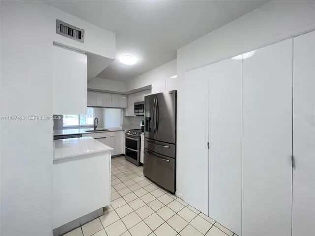 a kitchen with a washer and dryer