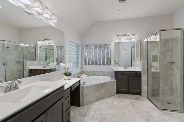a bathroom with a double vanity sink mirror and double