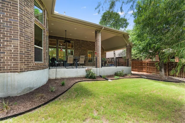 a view of a house with a yard patio and a patio