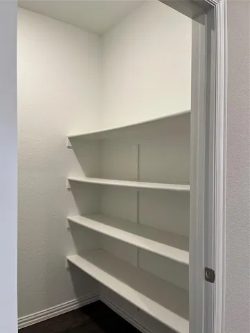 a kitchen with granite countertop a sink and a stove