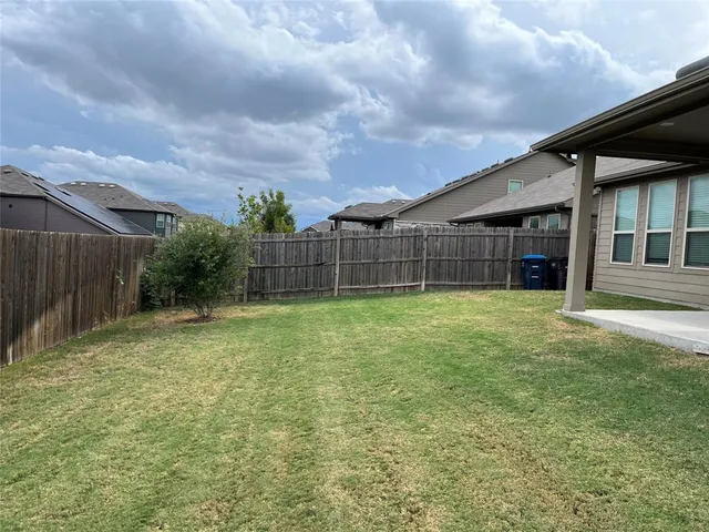 a view of house with yard