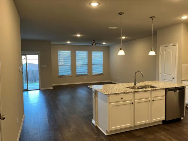 a view of a bathroom with dual sinks
