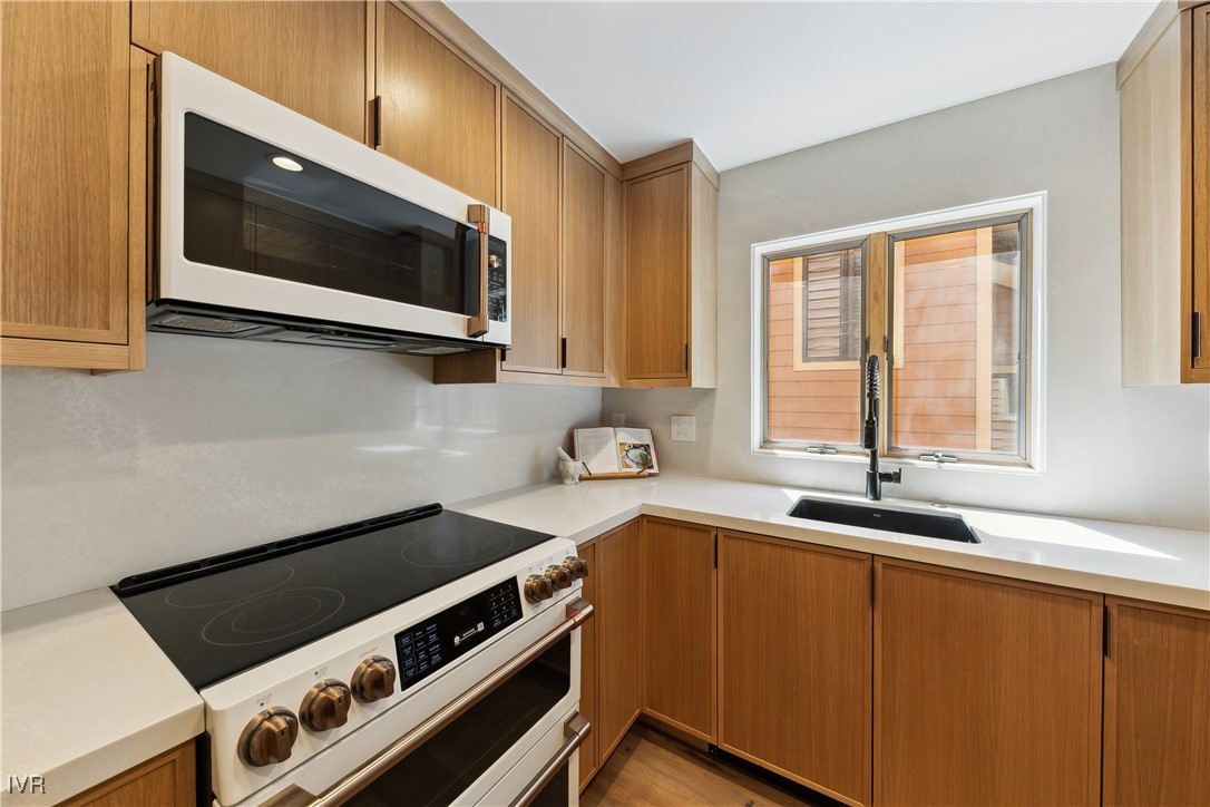 170 Village Boulevard, Unit 4 Incline Village, NV 89451 - Photo 11 of 21 a kitchen with a stove and a microwave