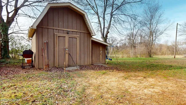 a view of a yard with a slide