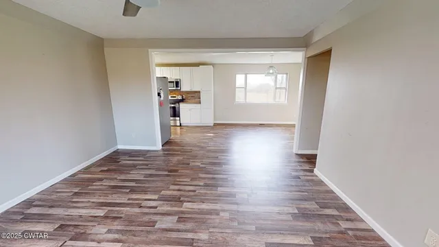 a view of a hallway with a door