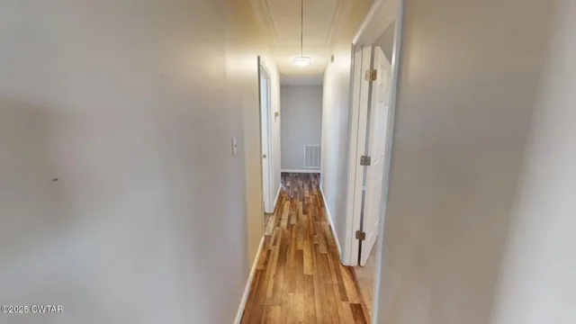 a view of a big room with carpet