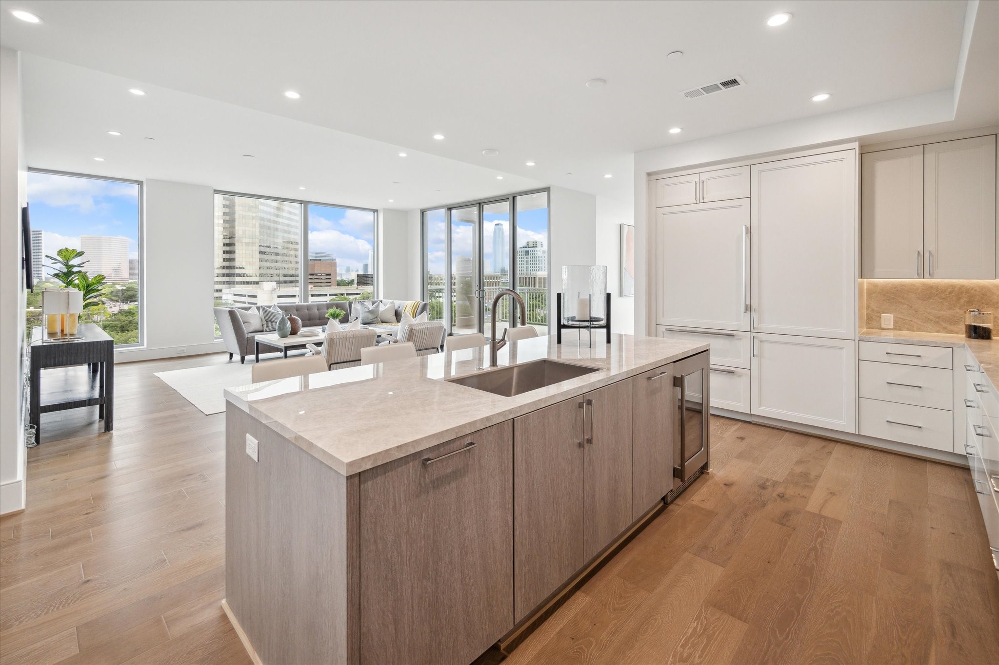5656 San Felipe Street, Unit 701 Houston, TX 77056 - Photo 31 of 45 a kitchen with counter top space sink and living room