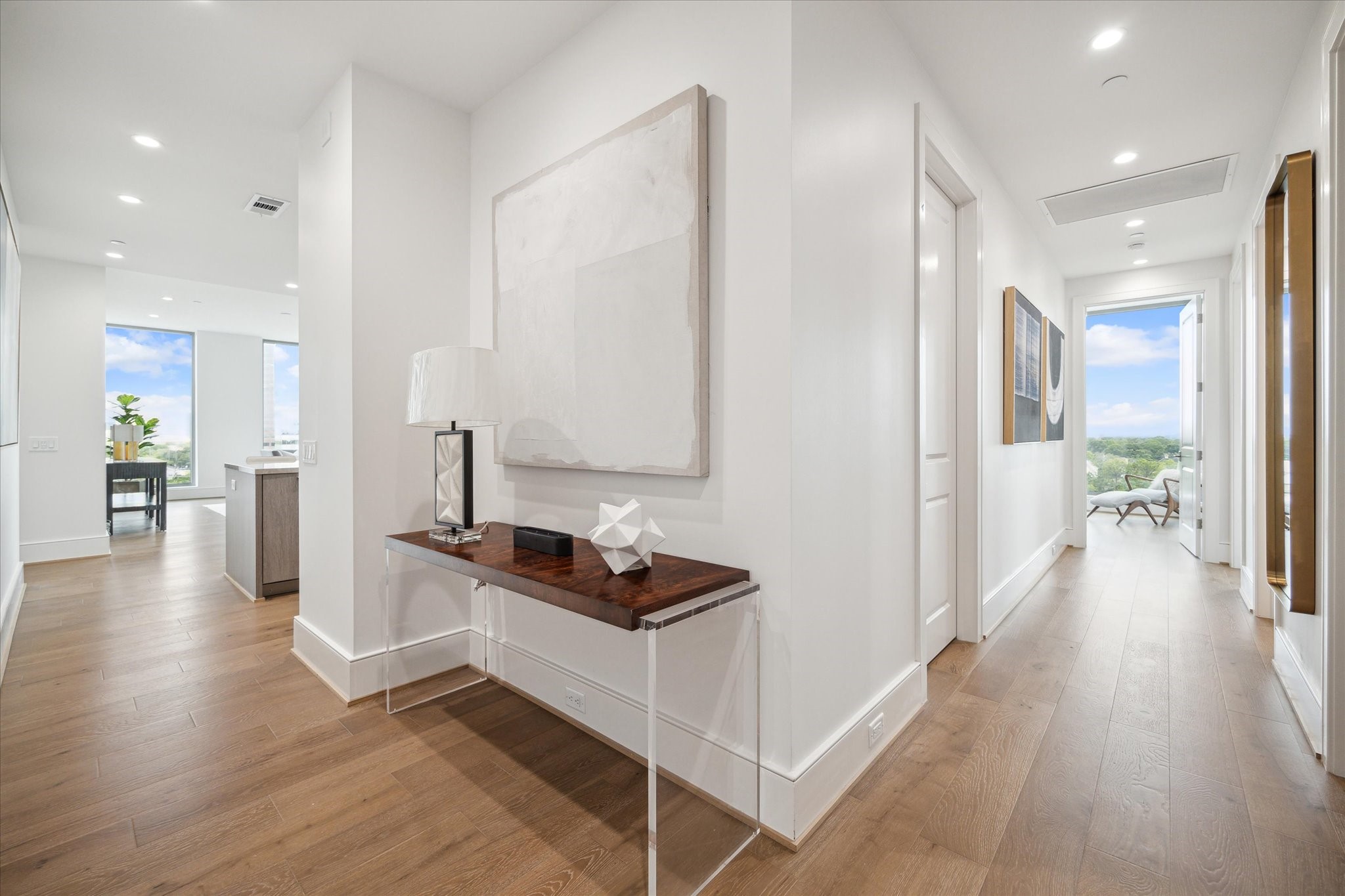 5656 San Felipe Street, Unit 701 Houston, TX 77056 - Photo 20 of 45 a hallway with a view of kitchen and living room