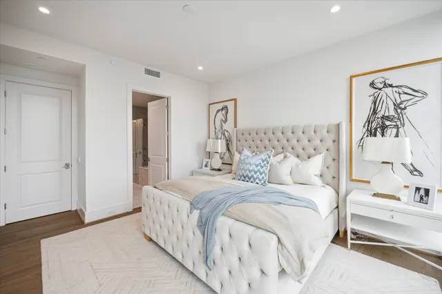 a view of a dining room with furniture and a kitchen view
