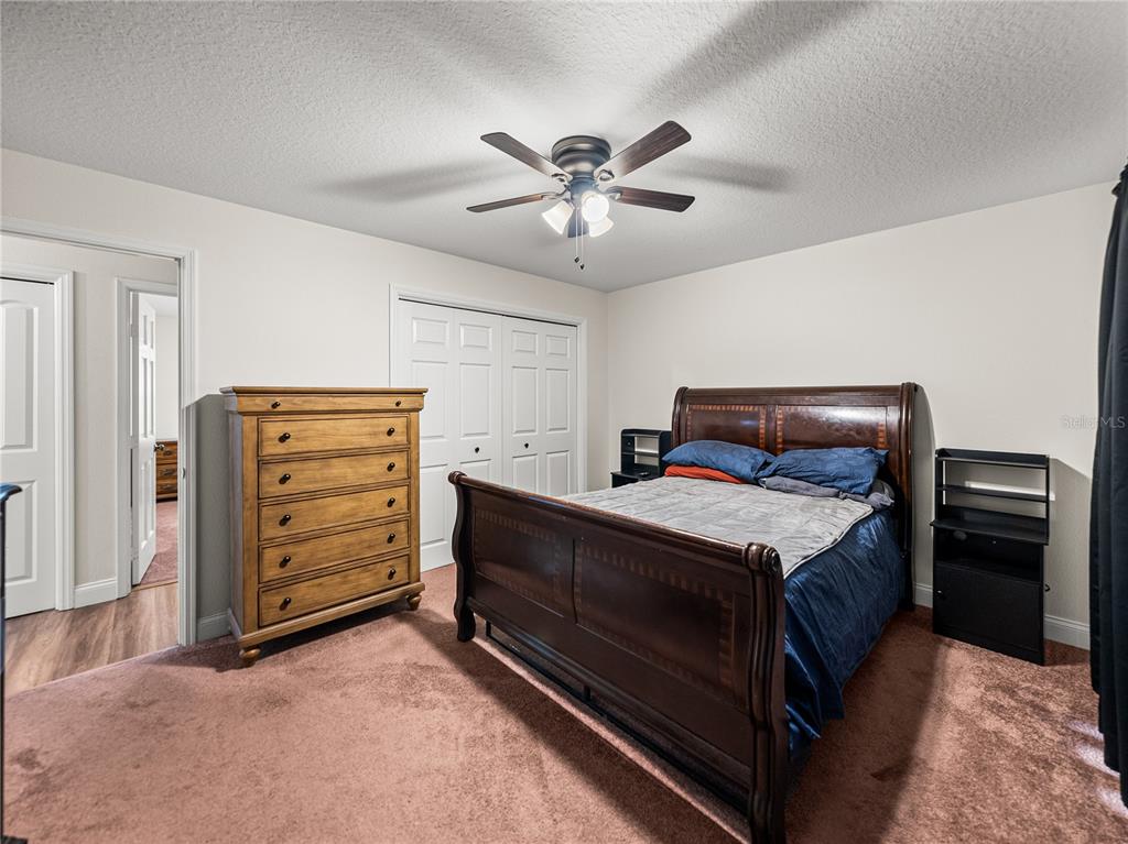 609 West Pipkin Road Lakeland, FL 33813 - Photo 38 of 72 a bedroom with a bed and a ceiling fan