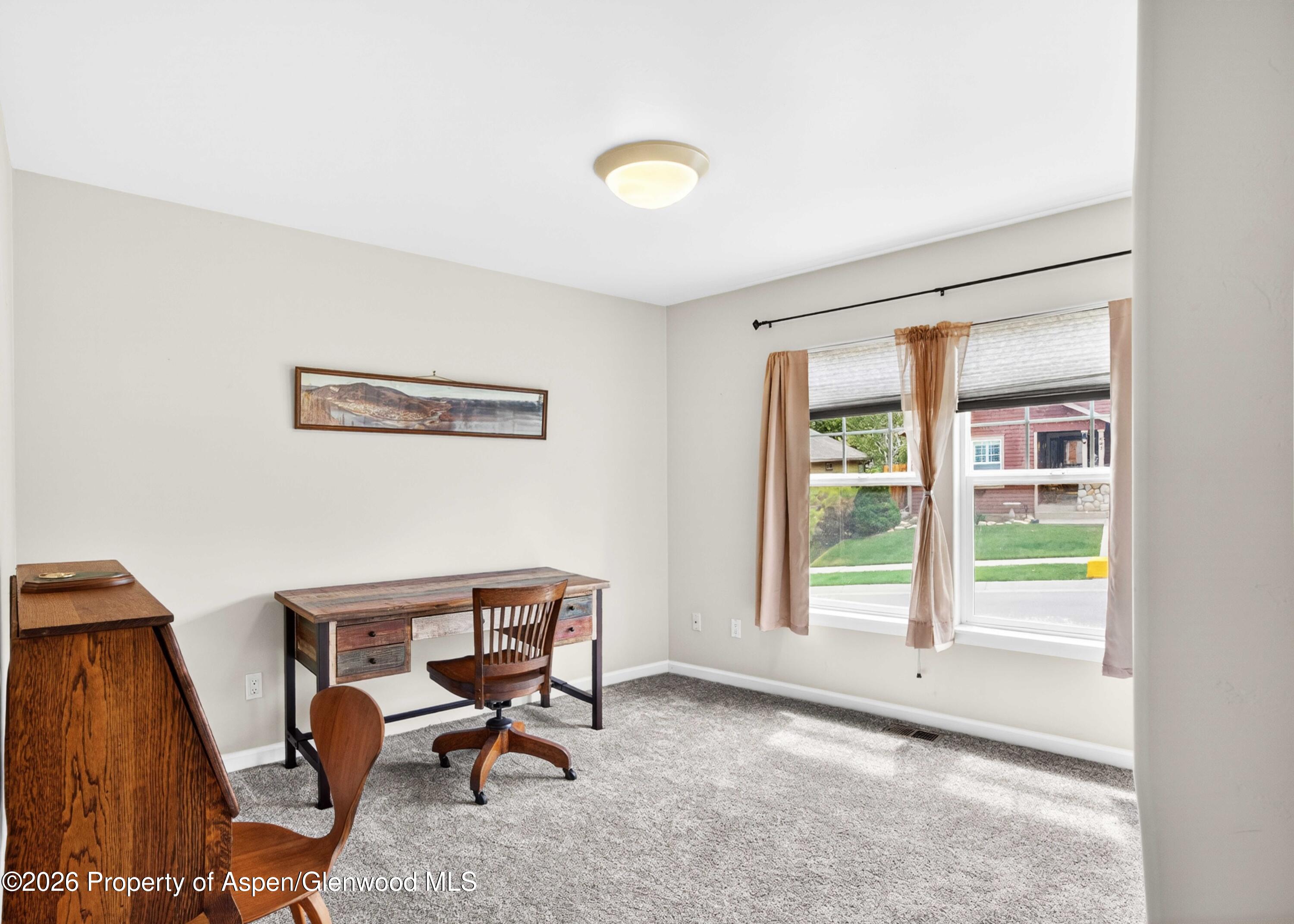 608 Lariat Loop New Castle, CO 81647 - Photo 21 of 32 a view of a workspace with furniture and a window