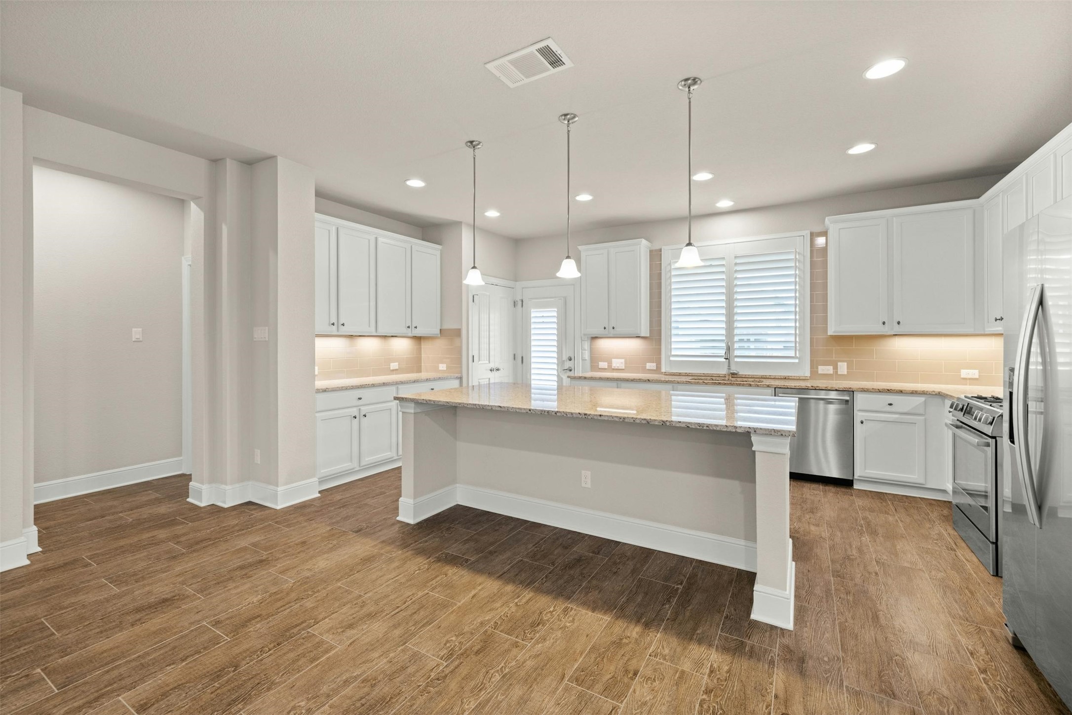 316 Crossvine Trail Georgetown, TX 78626 - Photo 15 of 37 a large white kitchen with a large window