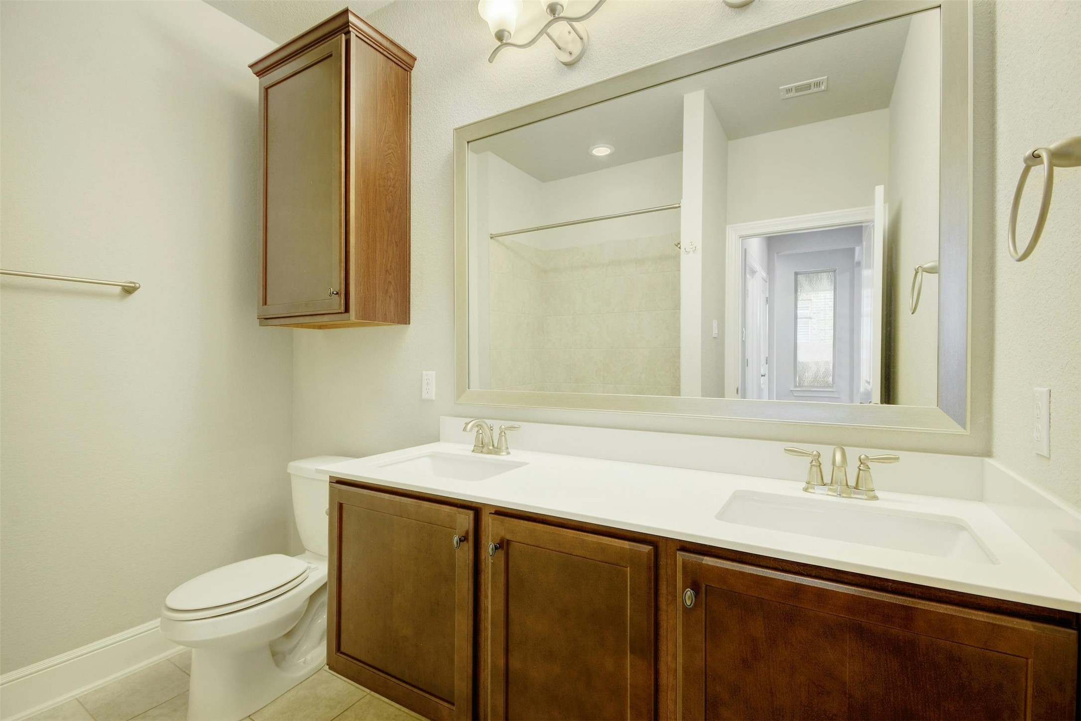 316 Crossvine Trail Georgetown, TX 78626 - Photo 26 of 37 a bathroom with a sink and a mirror