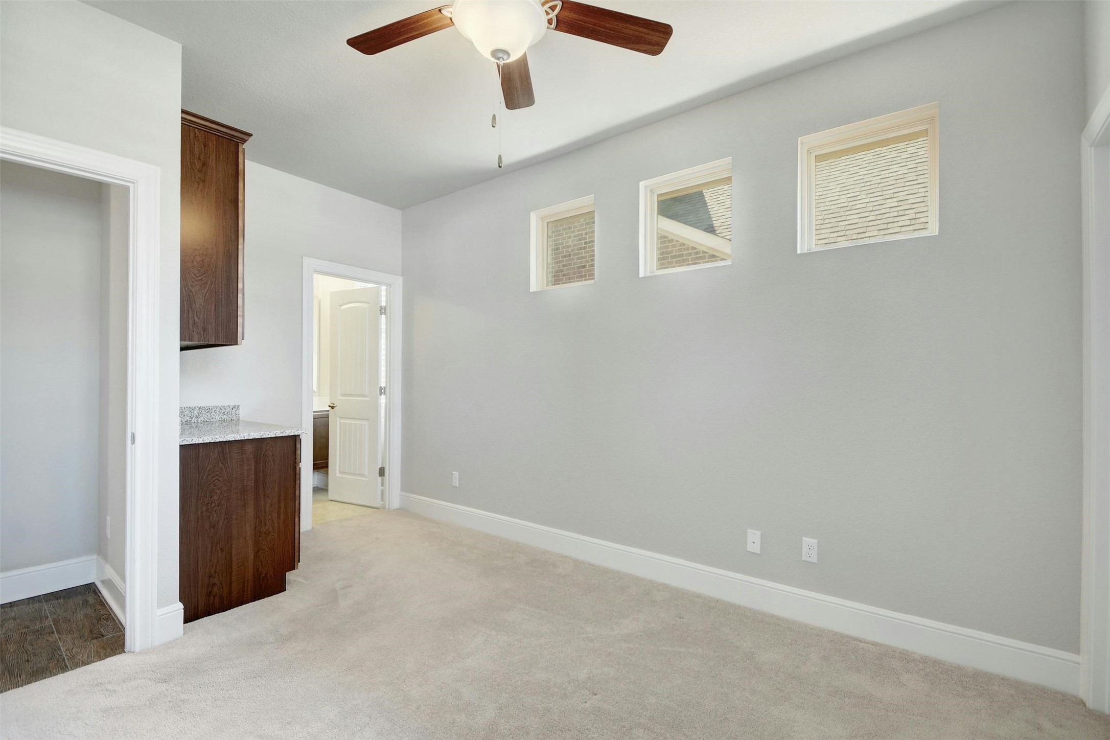 316 Crossvine Trail Georgetown, TX 78626 - Photo 28 of 37 en empty room with fireplace and ceiling fan