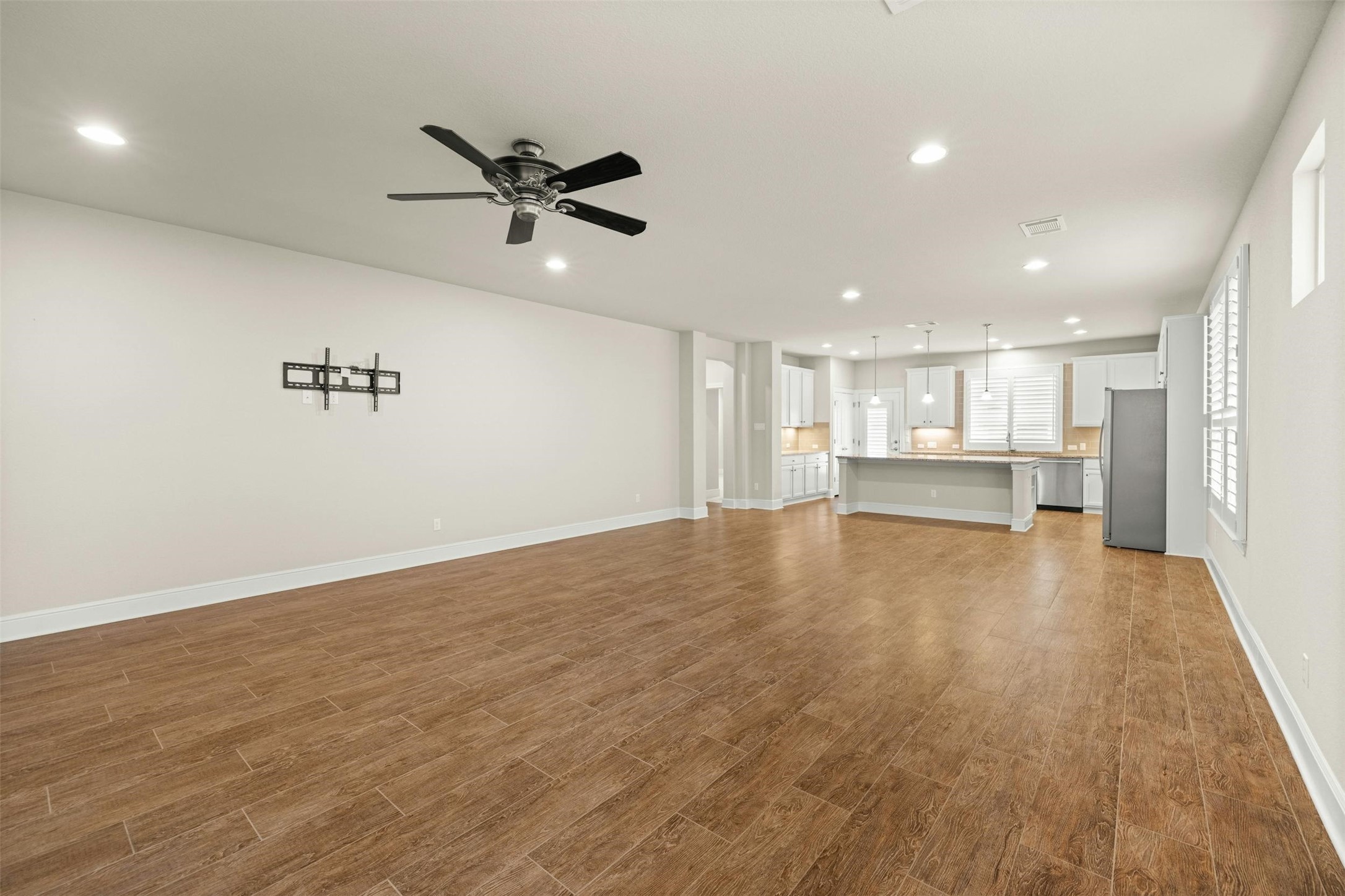 316 Crossvine Trail Georgetown, TX 78626 - Photo 8 of 37 a view of kitchen and hall with wooden floor