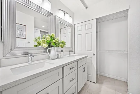 a bathroom with a sink a faucet and a mirror