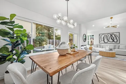 a view of a dining room with furniture window and outside view