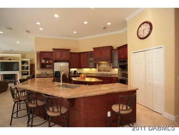 9 Remington Road Ormond Beach, FL 32174 - Photo 12 of 22 a kitchen with a table and chairs