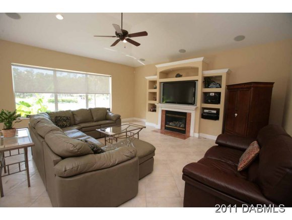 9 Remington Road Ormond Beach, FL 32174 - Photo 15 of 22 a living room with furniture and a fireplace