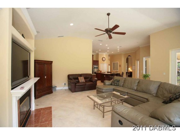 9 Remington Road Ormond Beach, FL 32174 - Photo 18 of 22 a living room with furniture and a flat screen tv