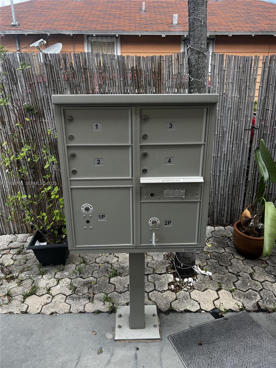 619 Southwest 11th Avenue, Unit 2 Miami, FL 33130 - Photo 5 of 10 a room with a wooden floor and a chair