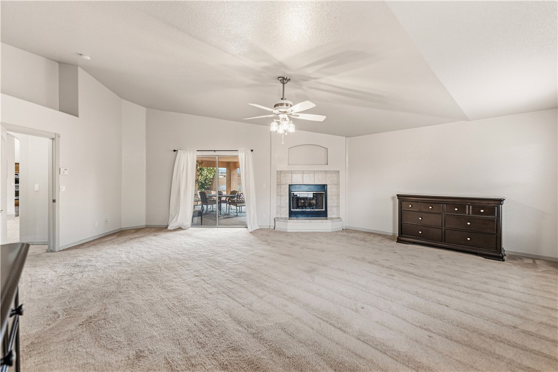 2940 Mountain Trail Road Kingman, AZ 86401 - Photo 12 of 53 an empty room with furniture and a fireplace