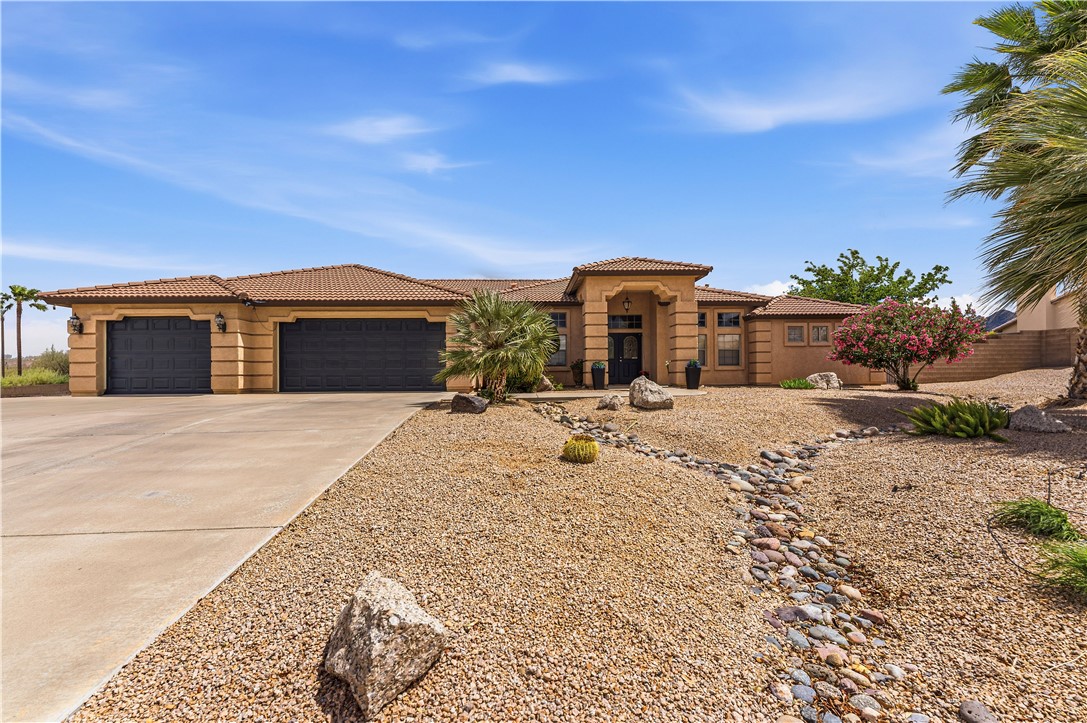 2940 Mountain Trail Road Kingman, AZ 86401 - Photo 2 of 53 a view of a house with a yard