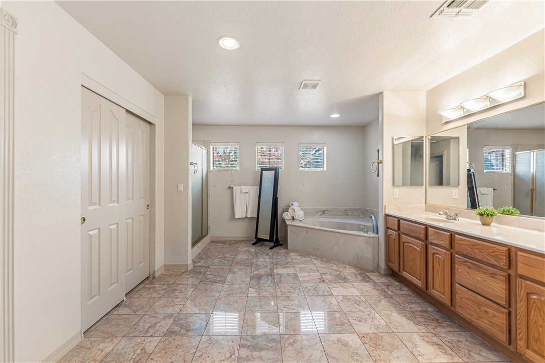 2940 Mountain Trail Road Kingman, AZ 86401 - Photo 25 of 53 a large bathroom with a granite countertop sink mirror and shower