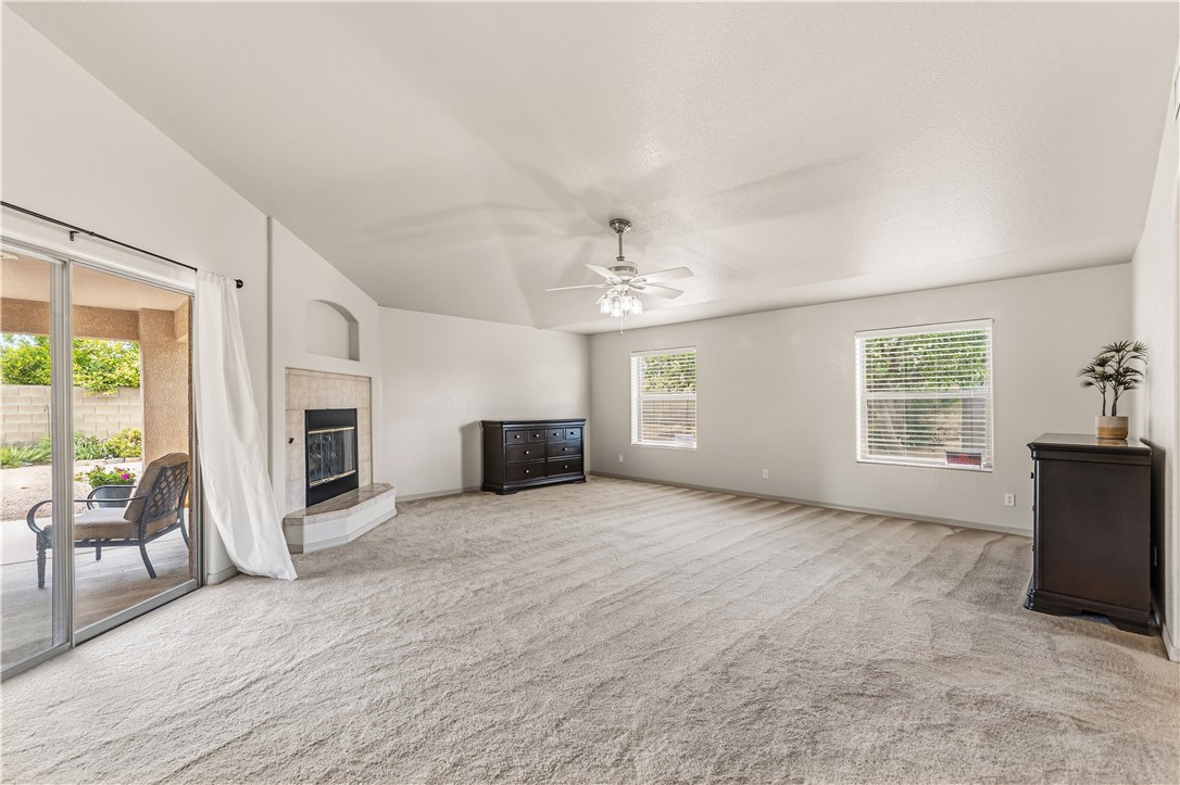 2940 Mountain Trail Road Kingman, AZ 86401 - Photo 26 of 53 a view of an empty room with a fireplace and a window