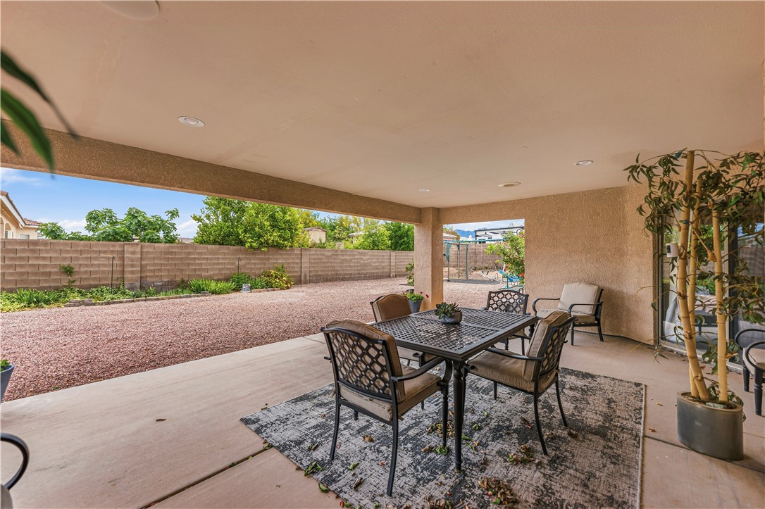 2940 Mountain Trail Road Kingman, AZ 86401 - Photo 29 of 53 a patio with table and chairs