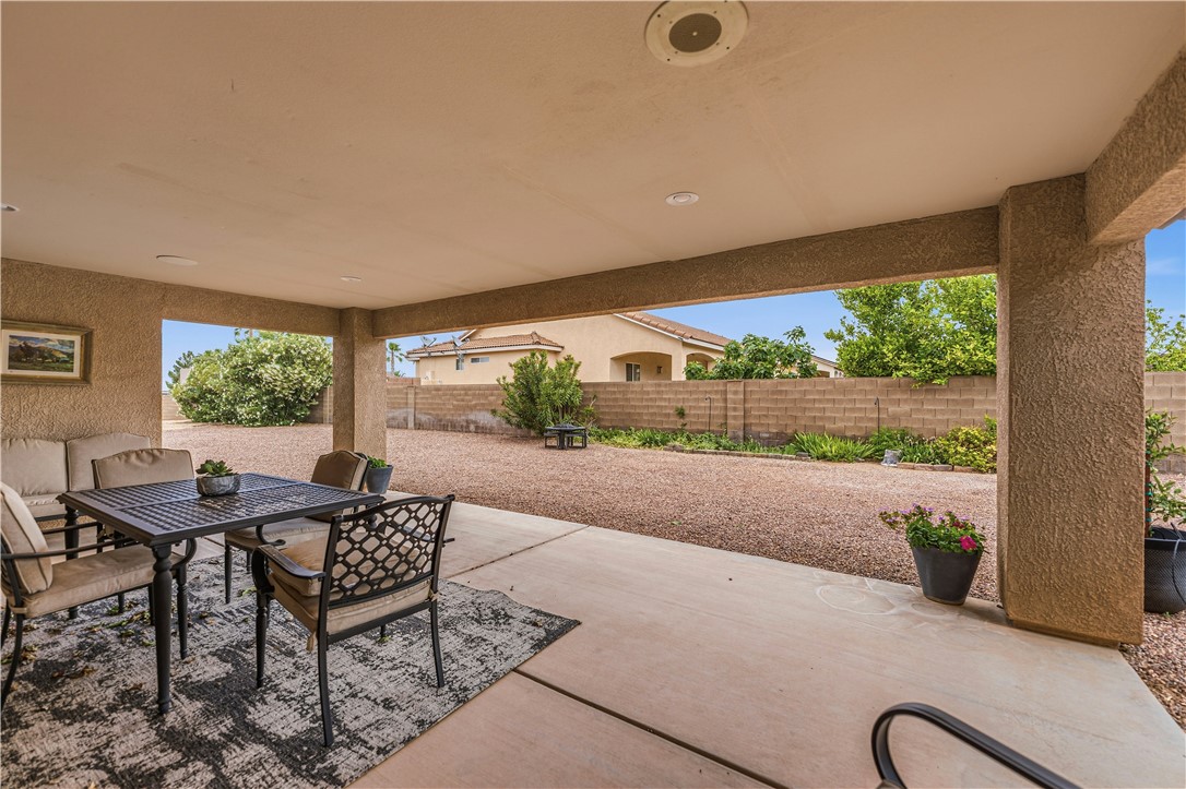 2940 Mountain Trail Road Kingman, AZ 86401 - Photo 30 of 53 a patio with table and chairs