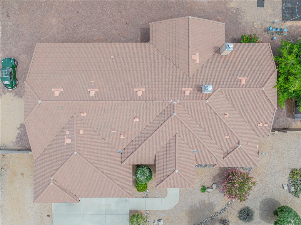 2940 Mountain Trail Road Kingman, AZ 86401 - Photo 40 of 53 an aerial view of a house with a yard and potted plants