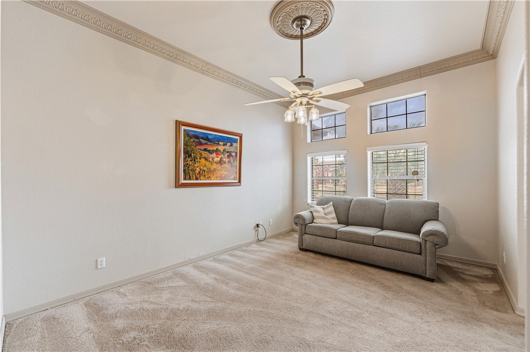 2940 Mountain Trail Road Kingman, AZ 86401 - Photo 5 of 53 a living room with furniture and a chandelier