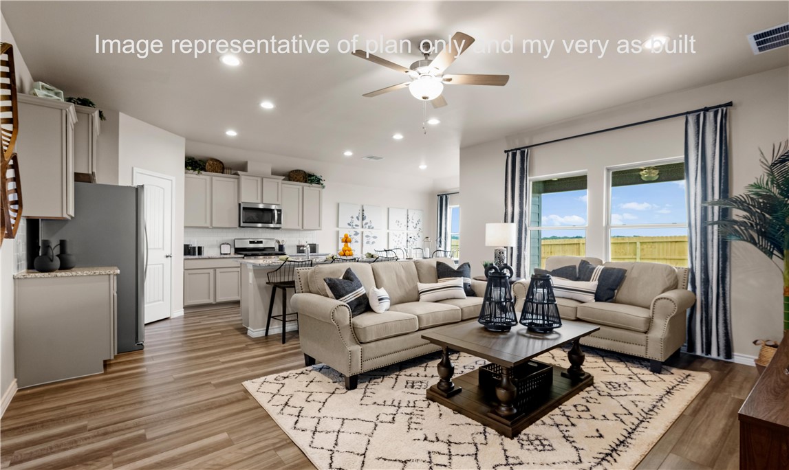 1503 Choctaw Road Sinton, TX 78387 - Photo 13 of 29 a living room with stainless steel appliances furniture a rug and a kitchen view