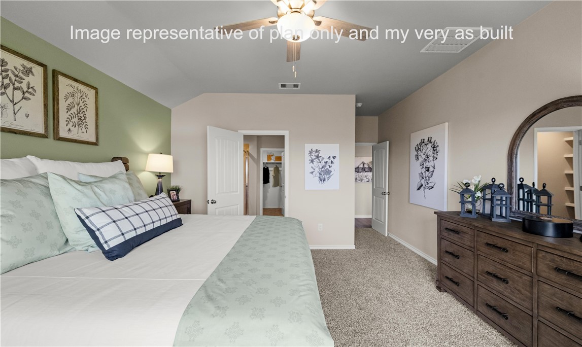 1503 Choctaw Road Sinton, TX 78387 - Photo 18 of 29 a spacious bedroom with furniture and a chandelier