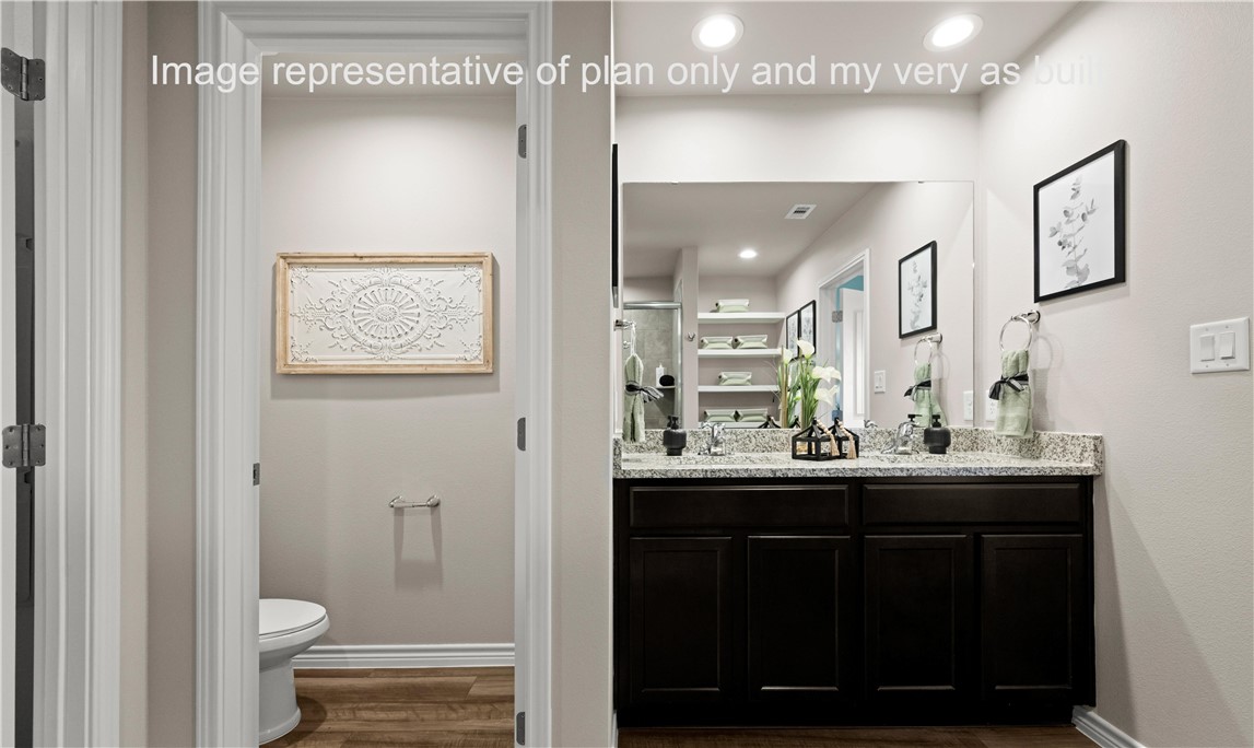 1503 Choctaw Road Sinton, TX 78387 - Photo 21 of 29 a bathroom with a sink and a mirror with toilet