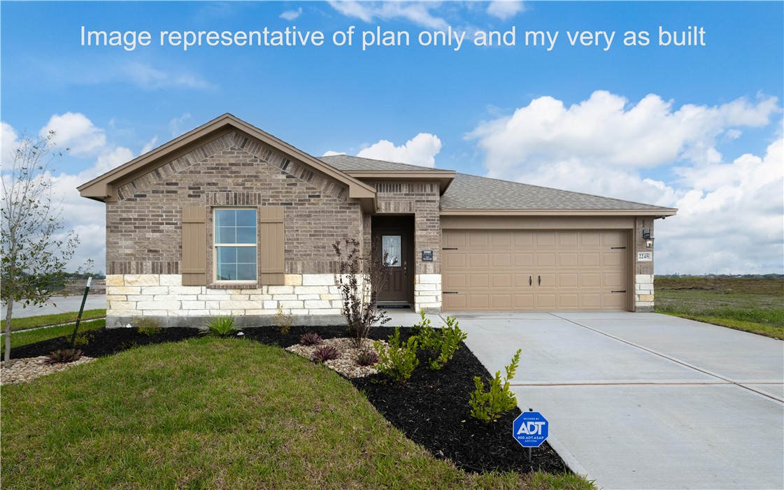 1503 Choctaw Road Sinton, TX 78387 - Photo 4 of 29 a front view of a house with a yard and garage