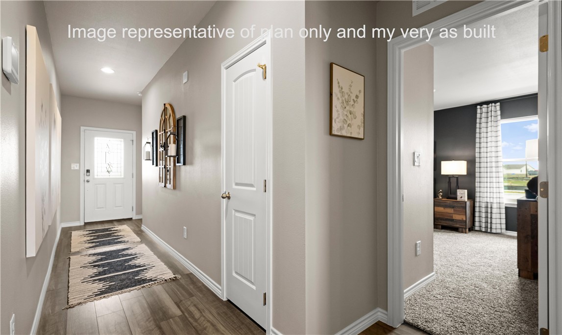 1503 Choctaw Road Sinton, TX 78387 - Photo 5 of 29 a view of a hallway with wooden floor and windows